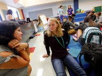 Special Education Director Erin Ptaszenski offers assistance to Skyla Lynk-Romano, 15, as she and fellow freshmen settle in to her class orientation.  Skyla Lynk-Romano who suffered a traumatic brain injury when she was struck by a car on January 5th attends her first day of school at the Greater New Bedford Regional Vocational Technical High School after a long rehabilitation process at the Pappas Rehabilitation Hospital for Children in Canton, MA. On January 5, 2017, Skyla, a freshman at Greater New Bedford Regional Vocational-Technical High School, was crossing Dartmouth Street to meet her father after leaving the Dancer’s Edge studio when she was hit by a car and critically injured. The driver, Jessica Skaggs, 34, fled the scene before turning herself in. Skaggs has been sentenced to six months at the House of Corrections, but the sentense was suspended for two years. PHOTO PETER PEREIRA